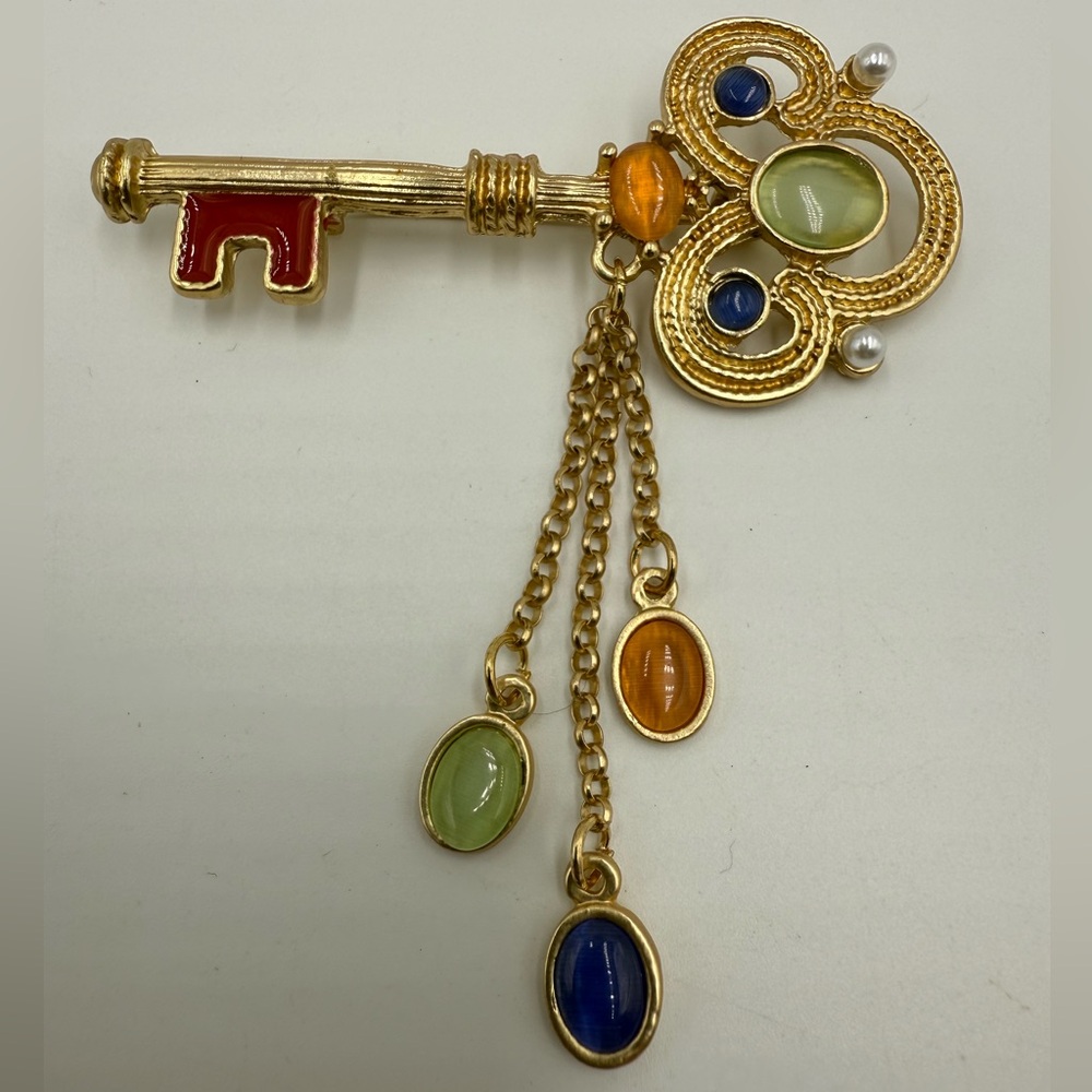 Elegant Gold Key Brooch with Multicolor Accents